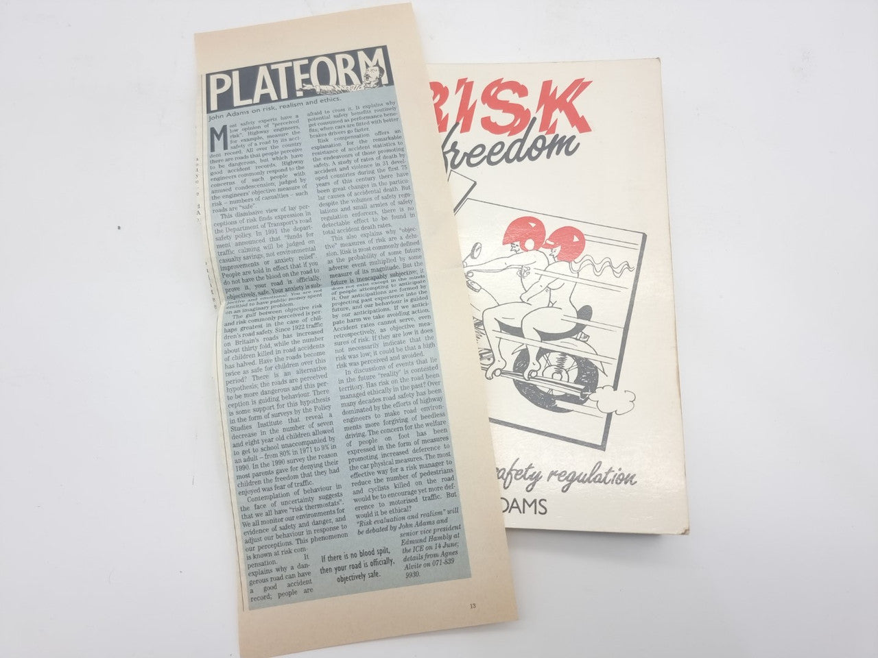 Magazine page beside road safety regulation book cover on right