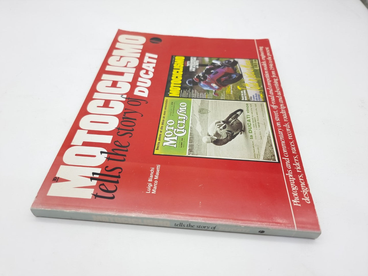 Red book cover, angled, showing “Motociclismo tells the story of Ducati” and inset photos