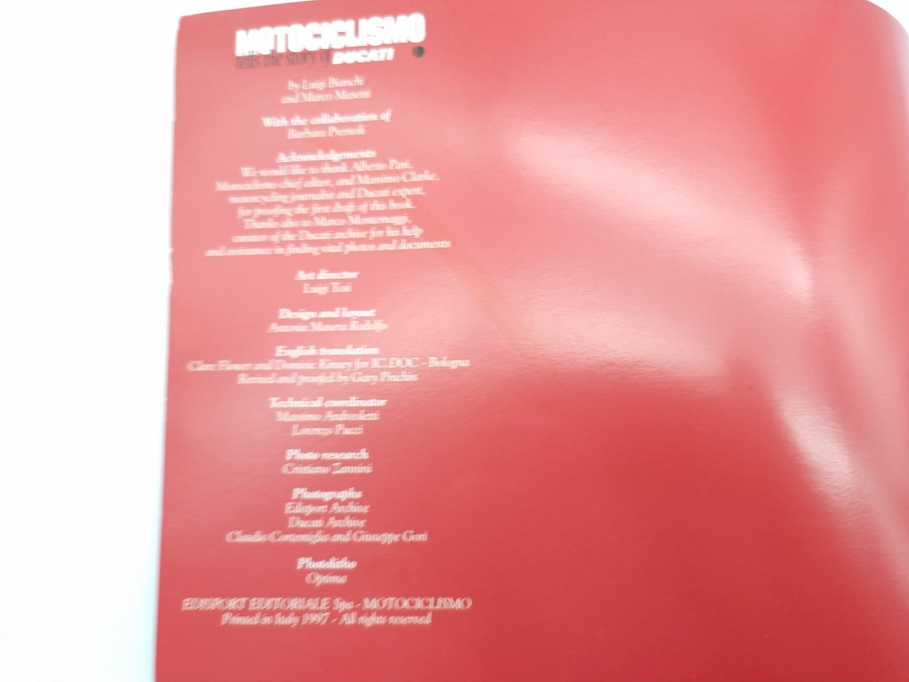 Red book back cover with dense white text block