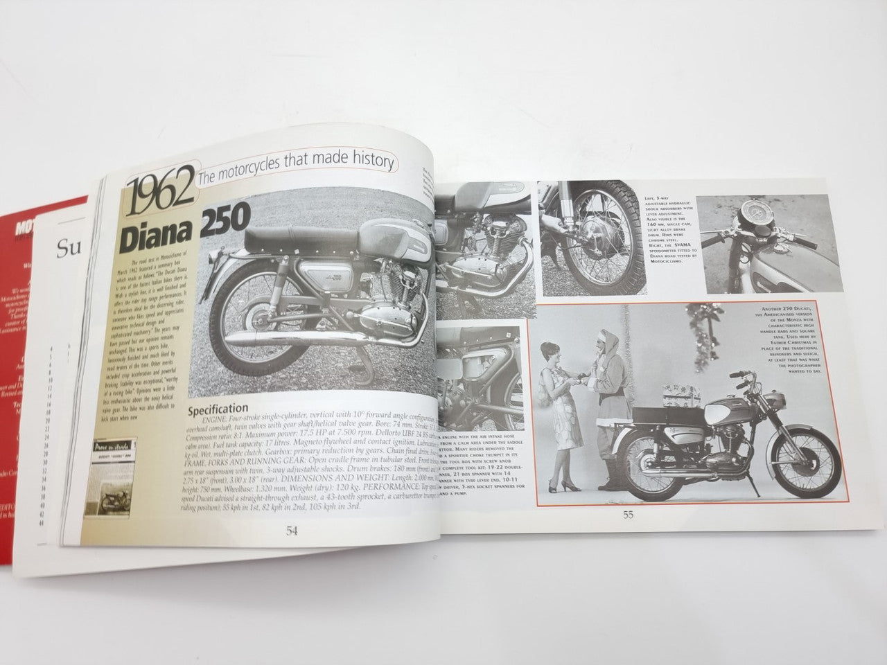 Open motorcycle history book page featuring a Ducati Diana 250 engine and bike photos