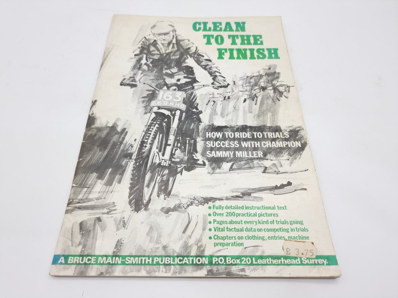 Motorcycle trials book cover titled "Clean to the Finish" with Sammy Miller subtitle