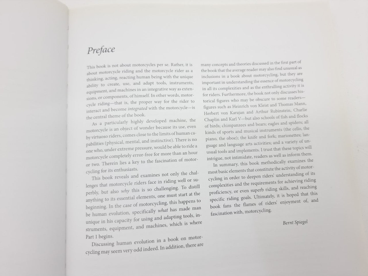 Open book preface pages with paragraphs and Bernt Spiegel signature text