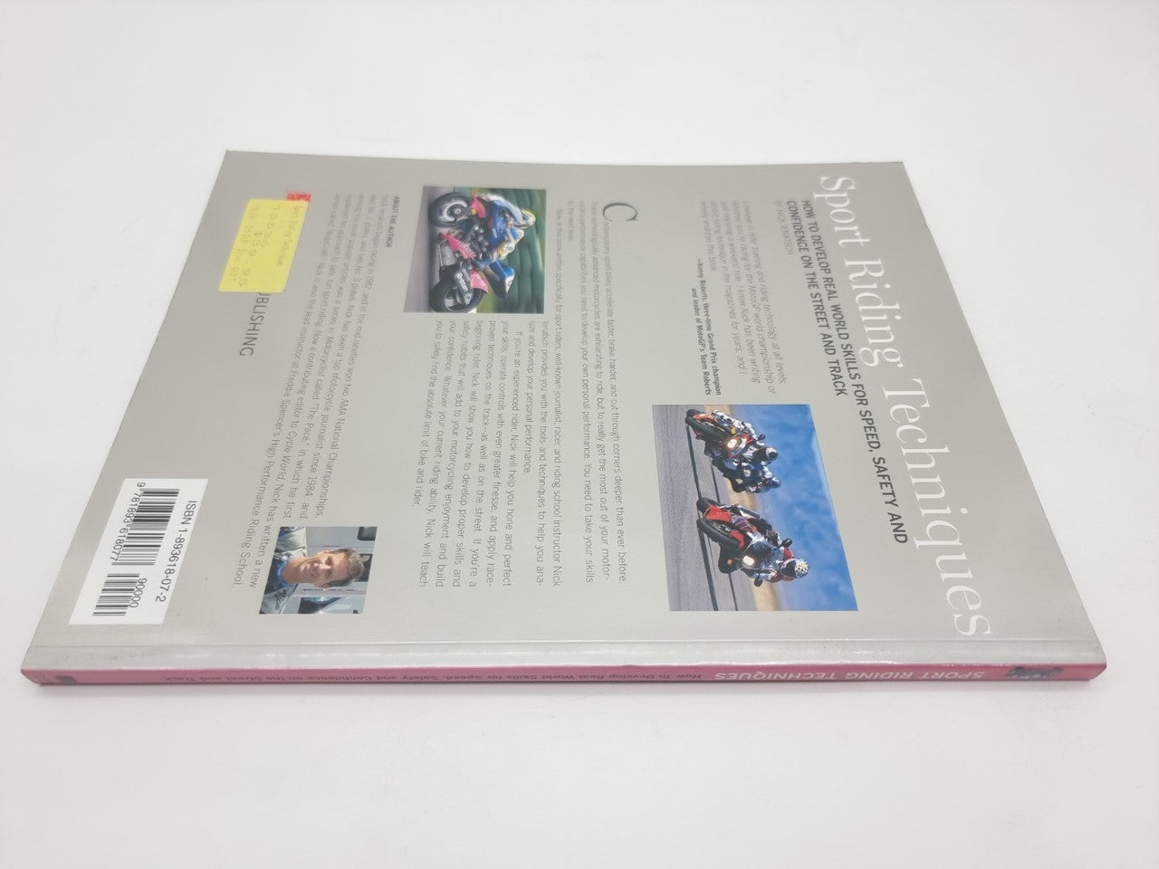 Back cover of Sport Riding Techniques book with printed text and photos