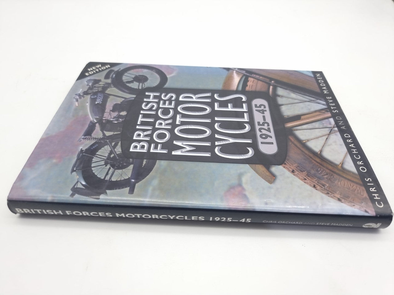 Motorcycles history book, illustrated cover with classic motorcycle collage and title