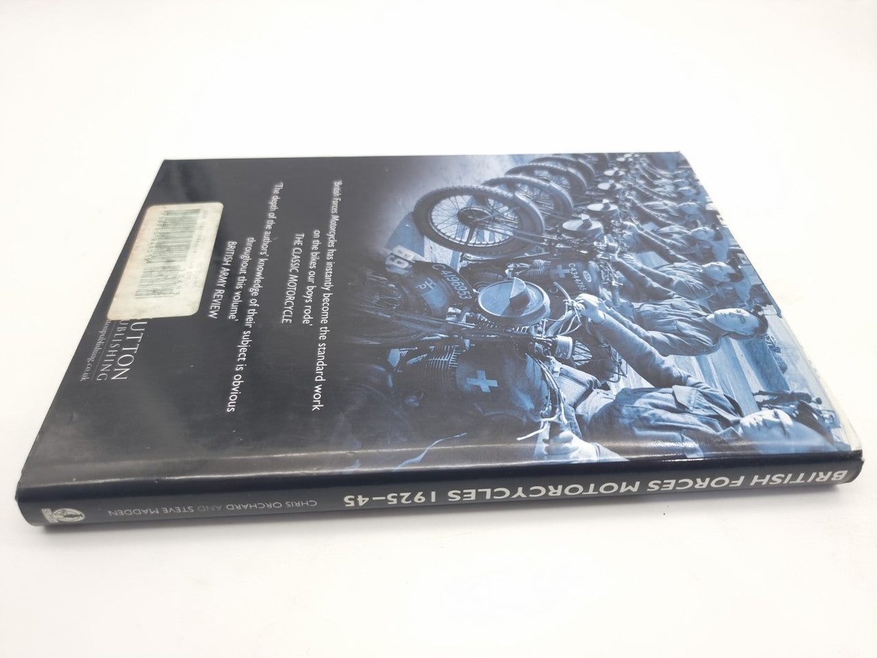 Motorcycles history book, back cover with blue-toned motorcycle engine photo