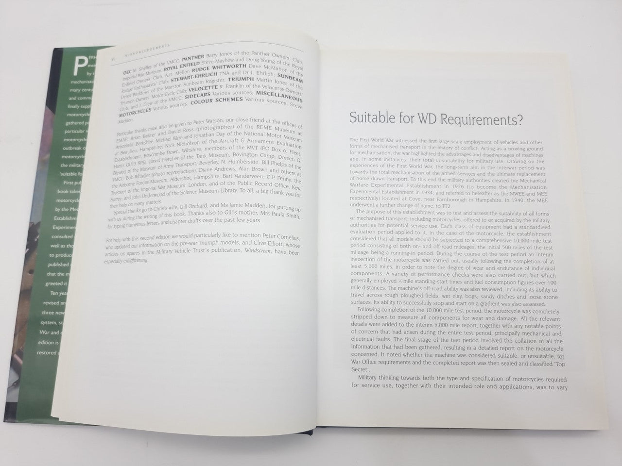 Open hardcover book spread with dense text paragraphs on both pages