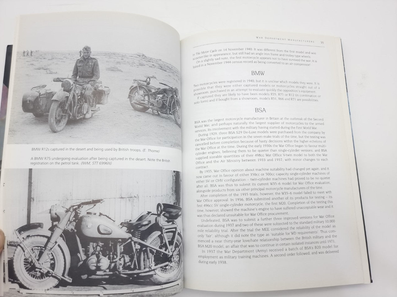 Motorcycles history book open, pages with black-and-white motorcycle photos and paragraphs