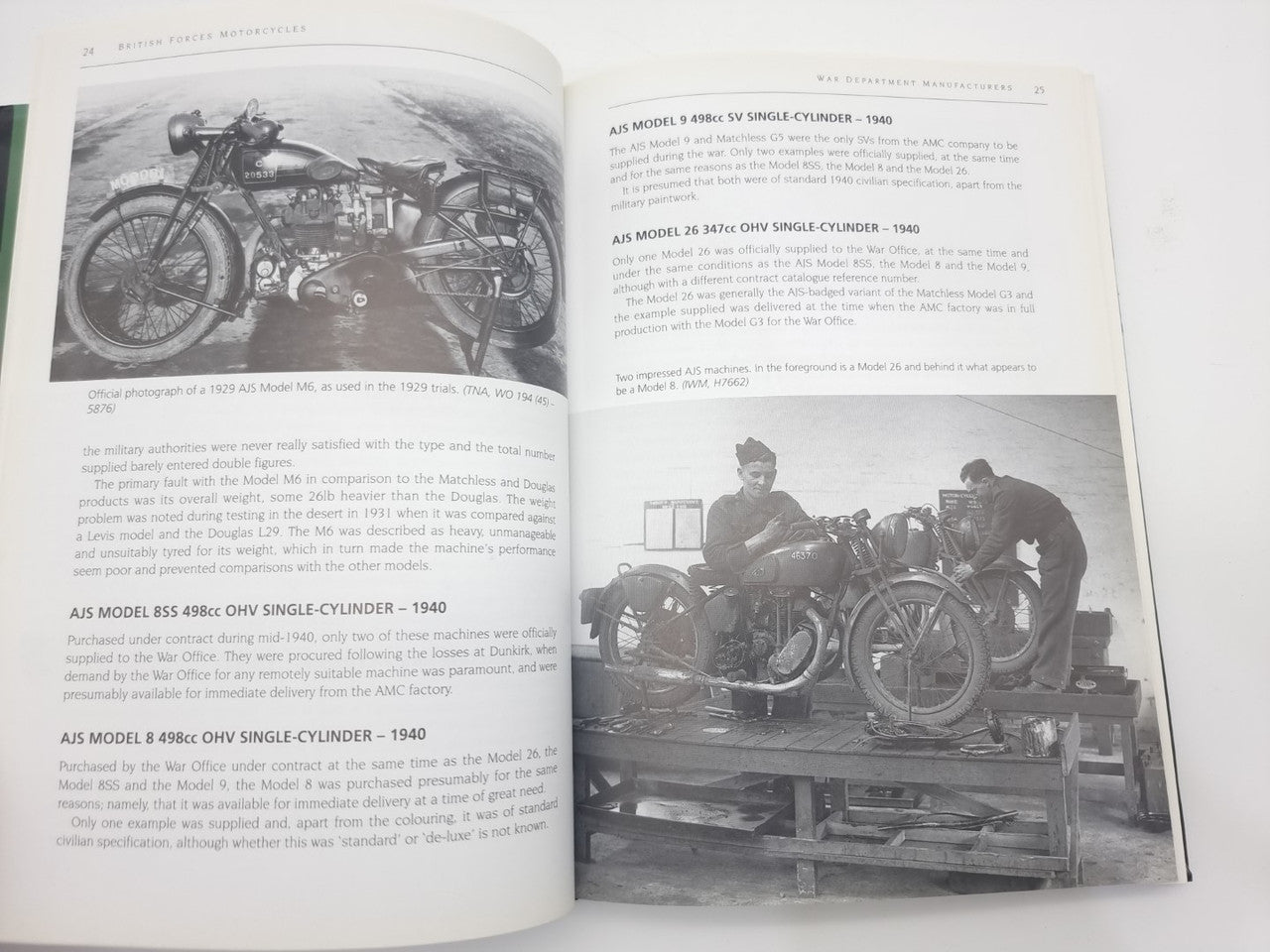 Open hardcover book showing motorcycle photos and labeled model text pages