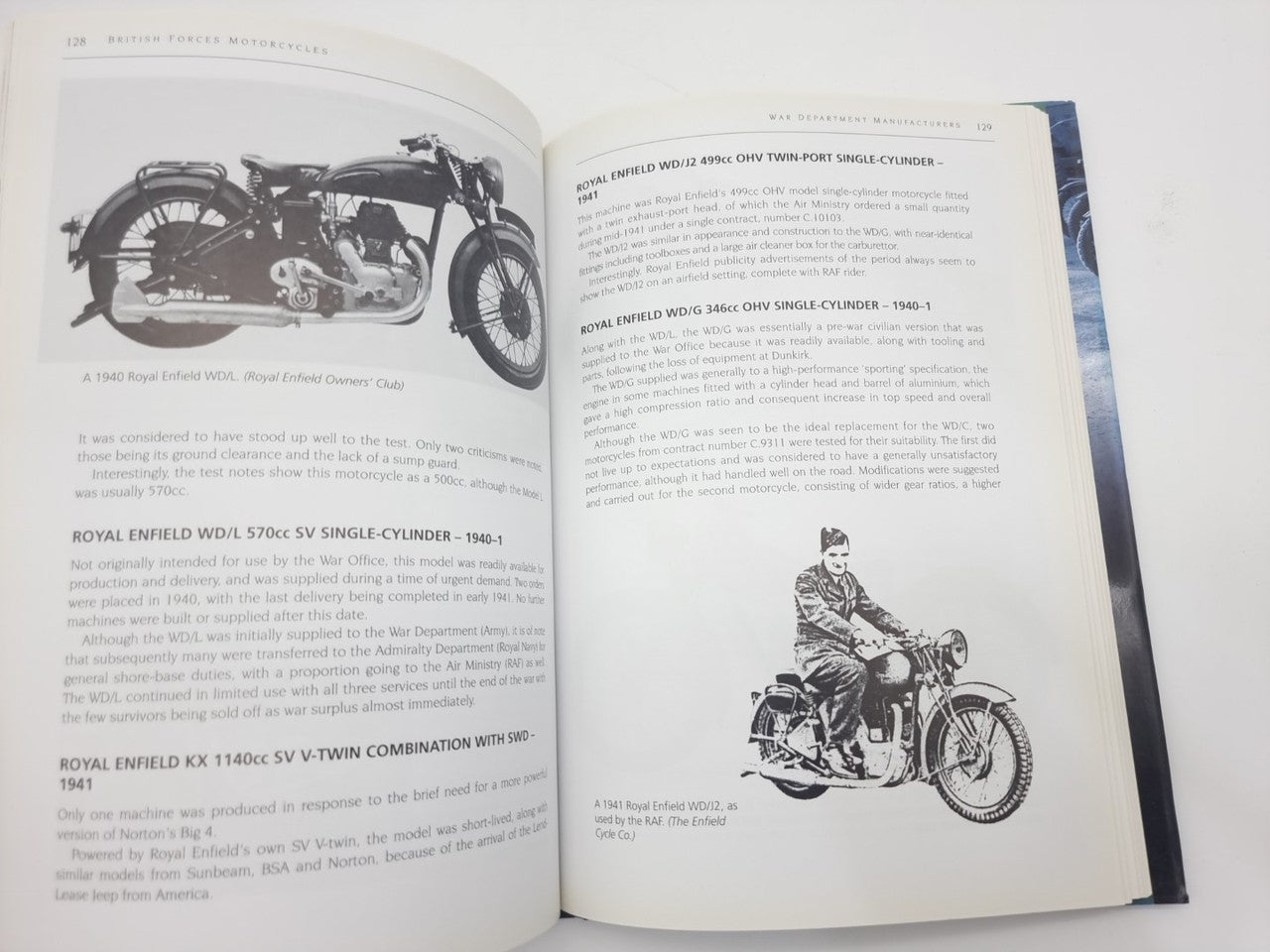 Motorcycles history book open, pages with vintage motorcycle photos and captions