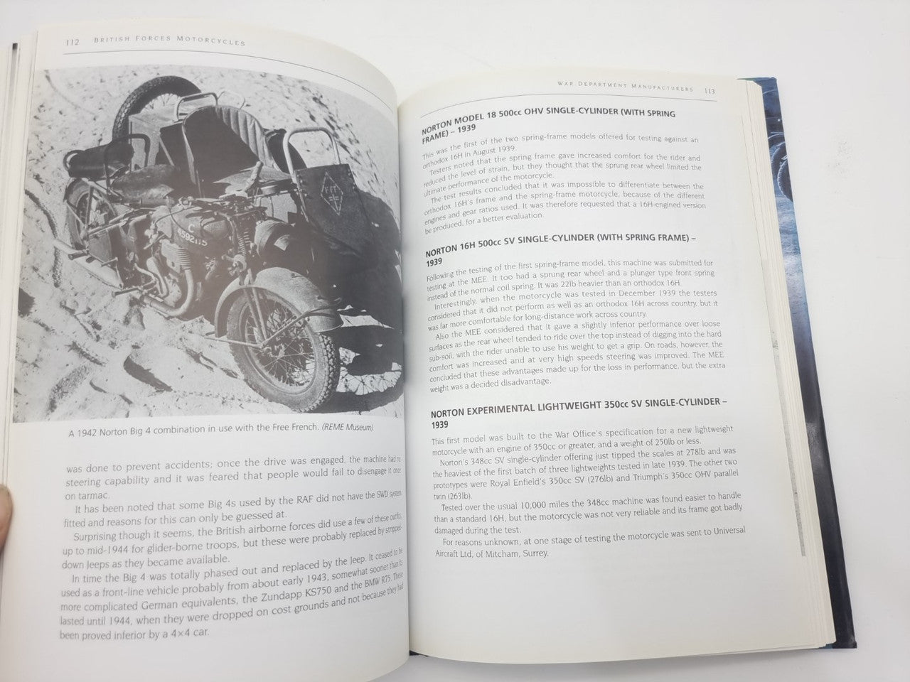 Open hardcover book with large black-and-white motorcycle photo on left page
