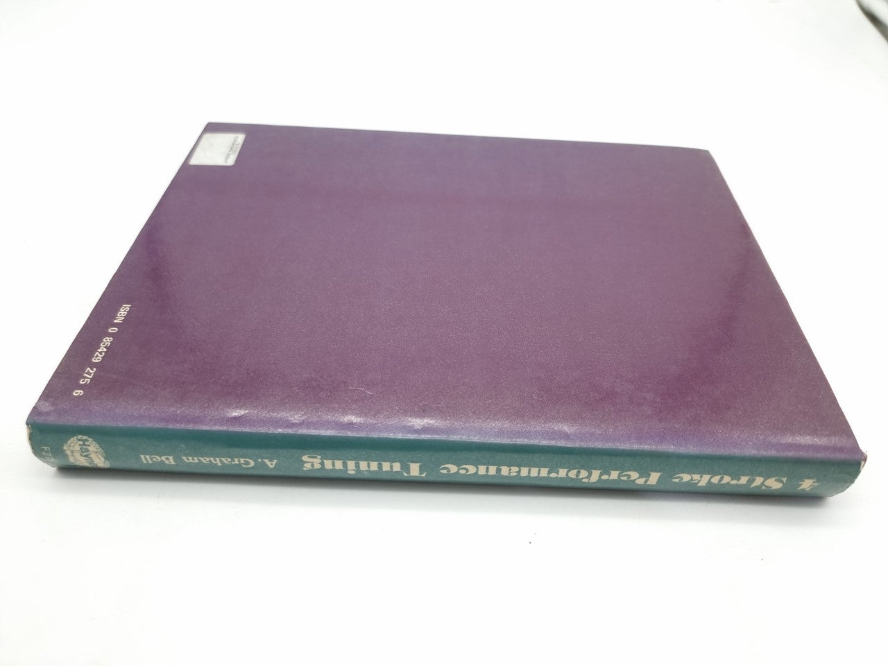 Book with purple back cover and small corner label near the top