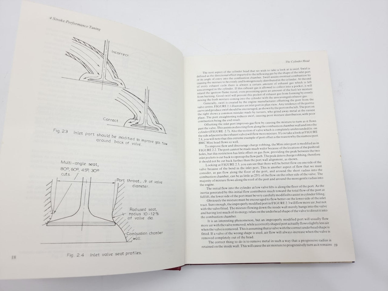 Open book with engine sketch diagrams on the left and text paragraphs on the right