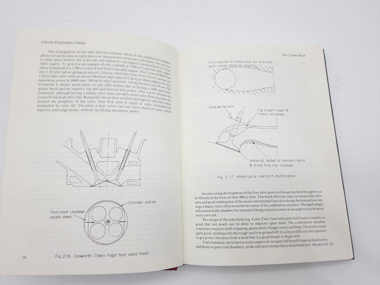 Open technical book with multiple engineering diagrams and charts beside text