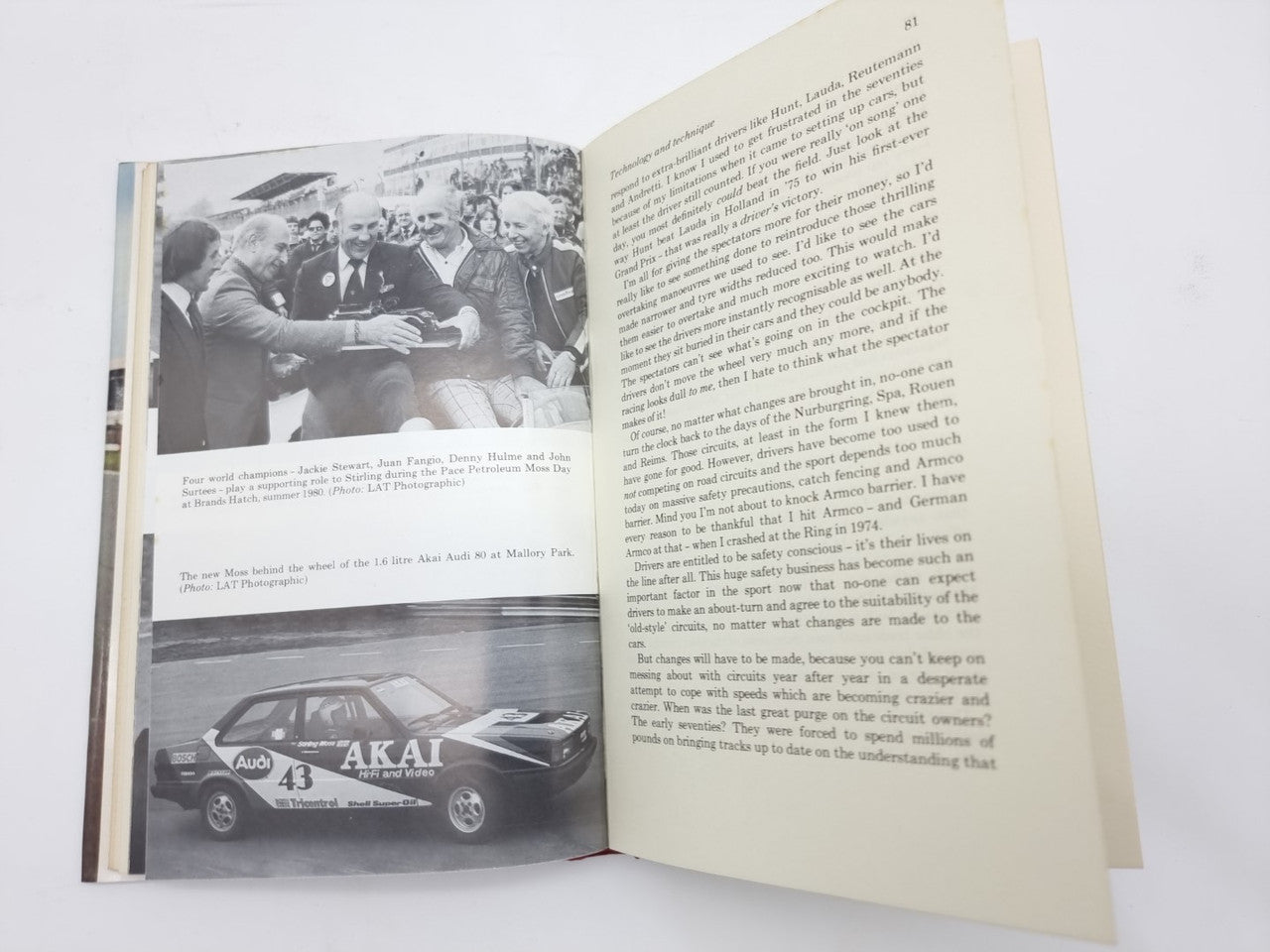 Open motorsport book spread with race photo and paragraph text