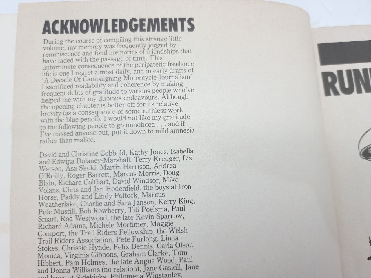 Paperback book open to acknowledgements page with paragraph text