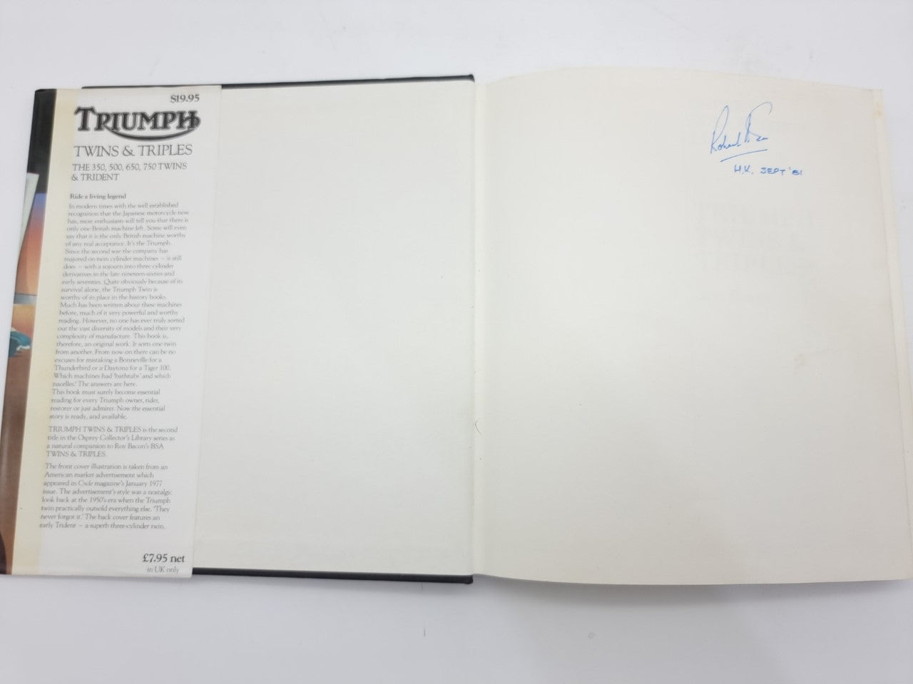 Open book with white pages and small printed text on the left