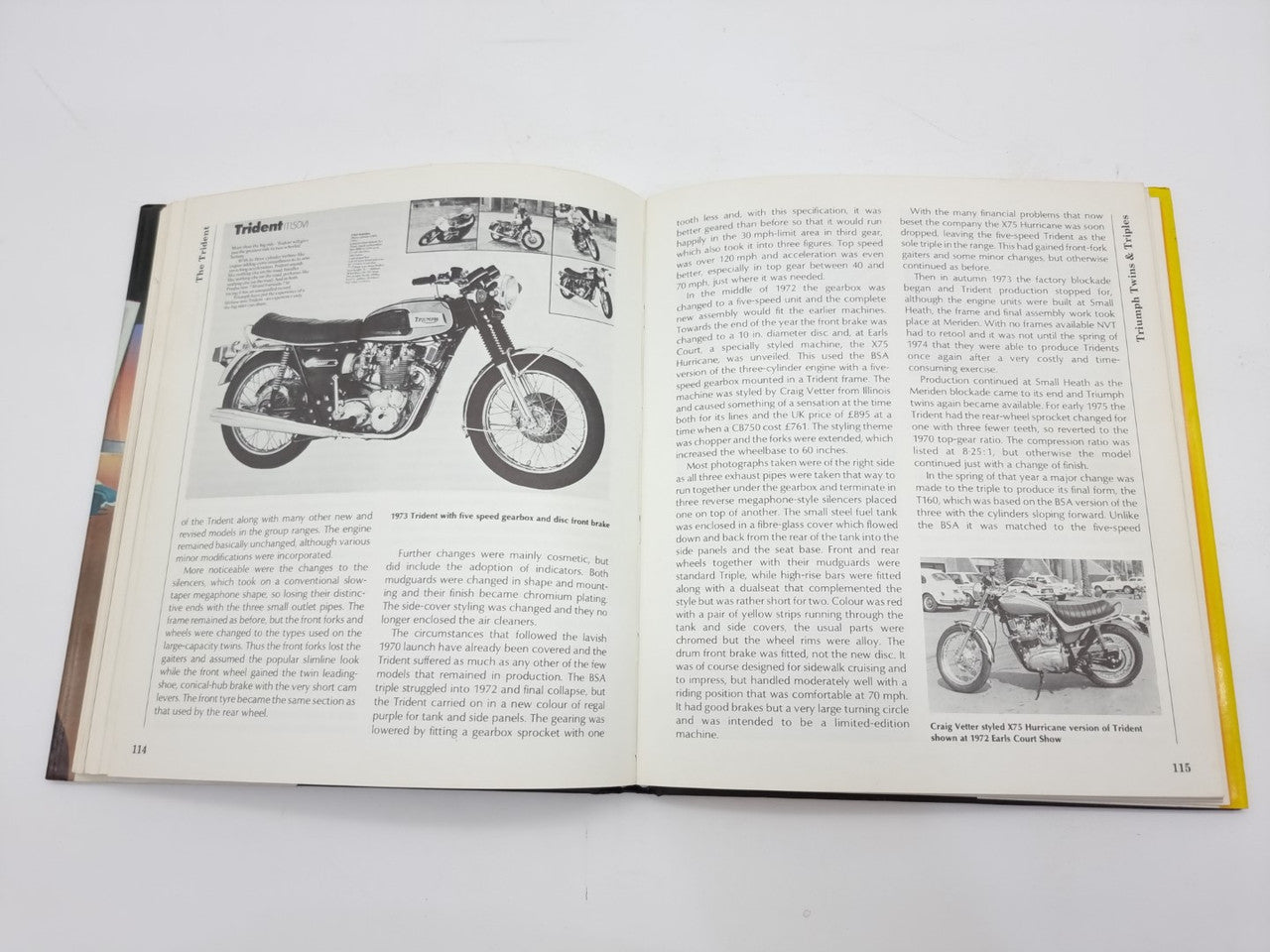 Open book spread with black-and-white motorcycle images and printed text