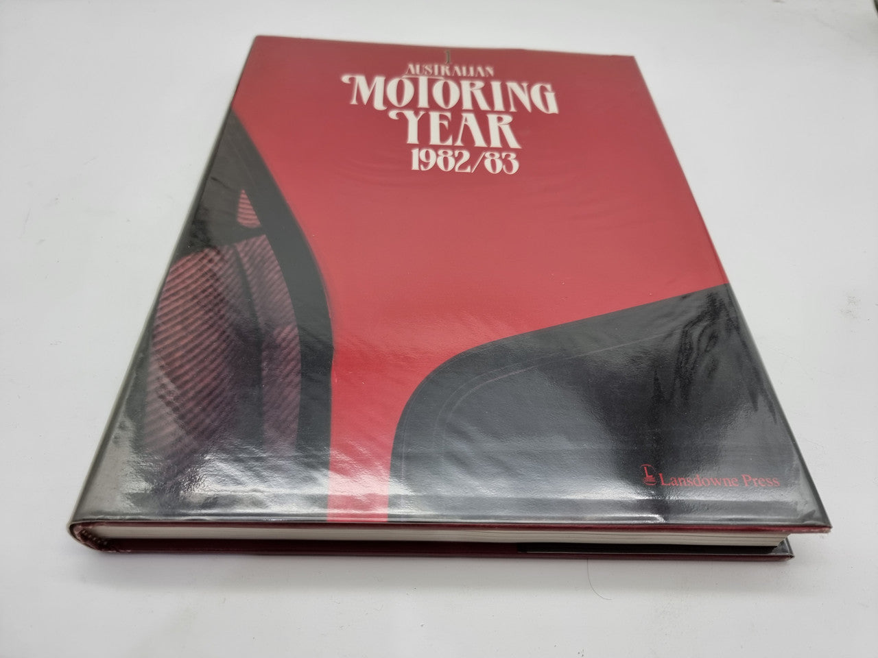 Motoring Year 1982/83 hardcover book, red with black and silver graphic cover