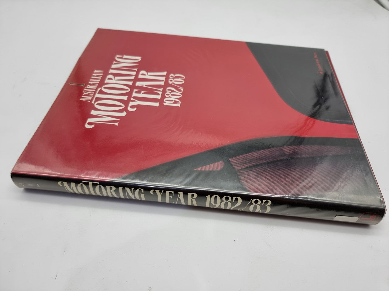 Motoring Year 1982/83 hardcover book, red cover with black spine and title text