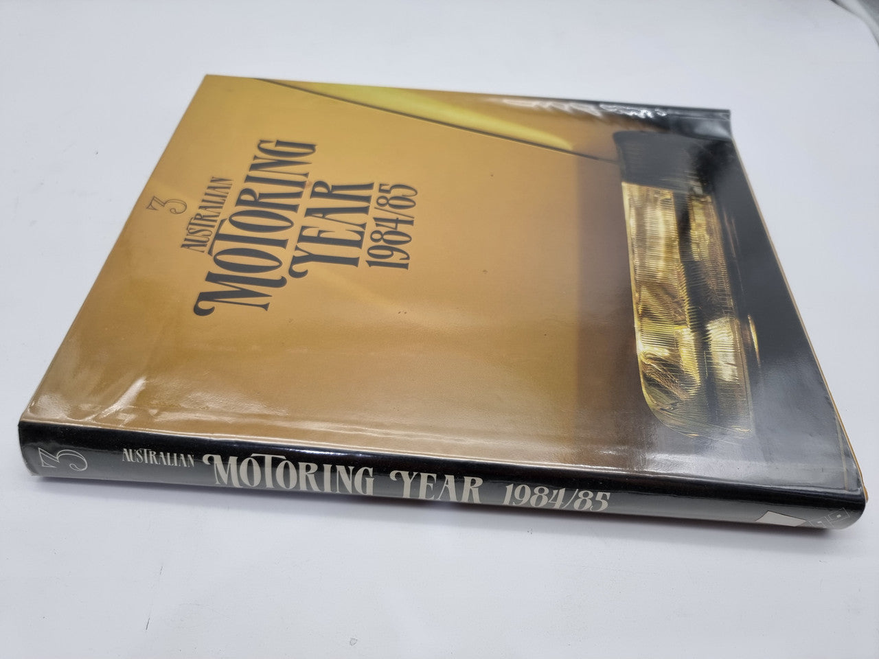 Australian Motoring Year 1984/85 hardcover book with side spine and cover text