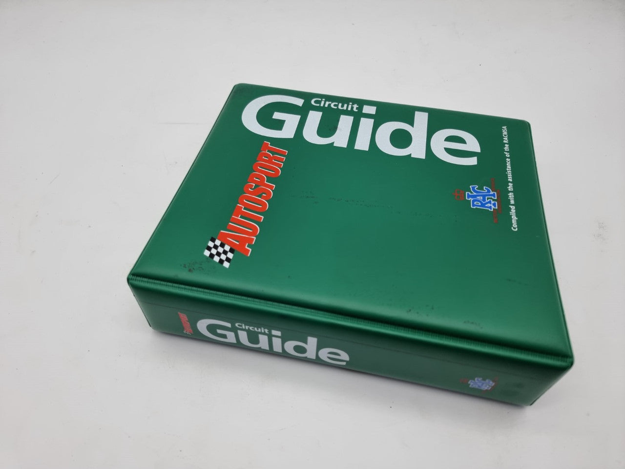 Green cover circuit guide book with large "Guide" text and racing graphics