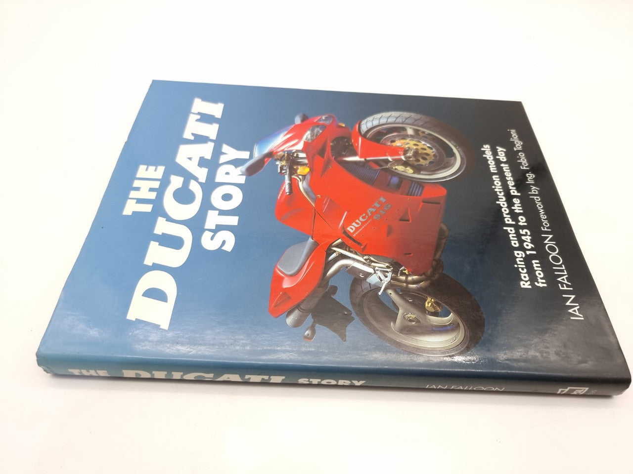 The Ducati Story book with red Ducati motorcycle and large vertical title