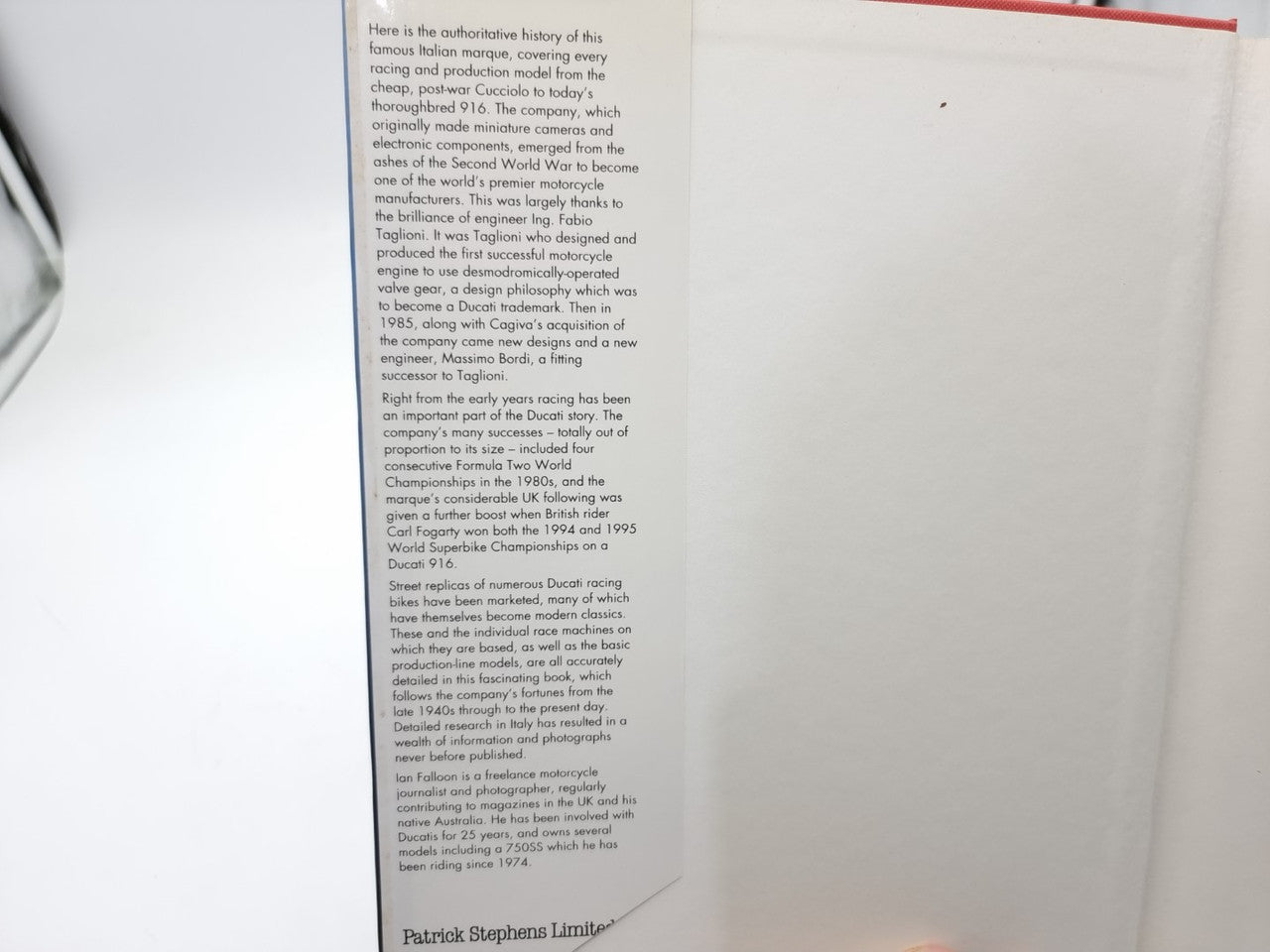 The Ducati Story open book close-up of a dense text page