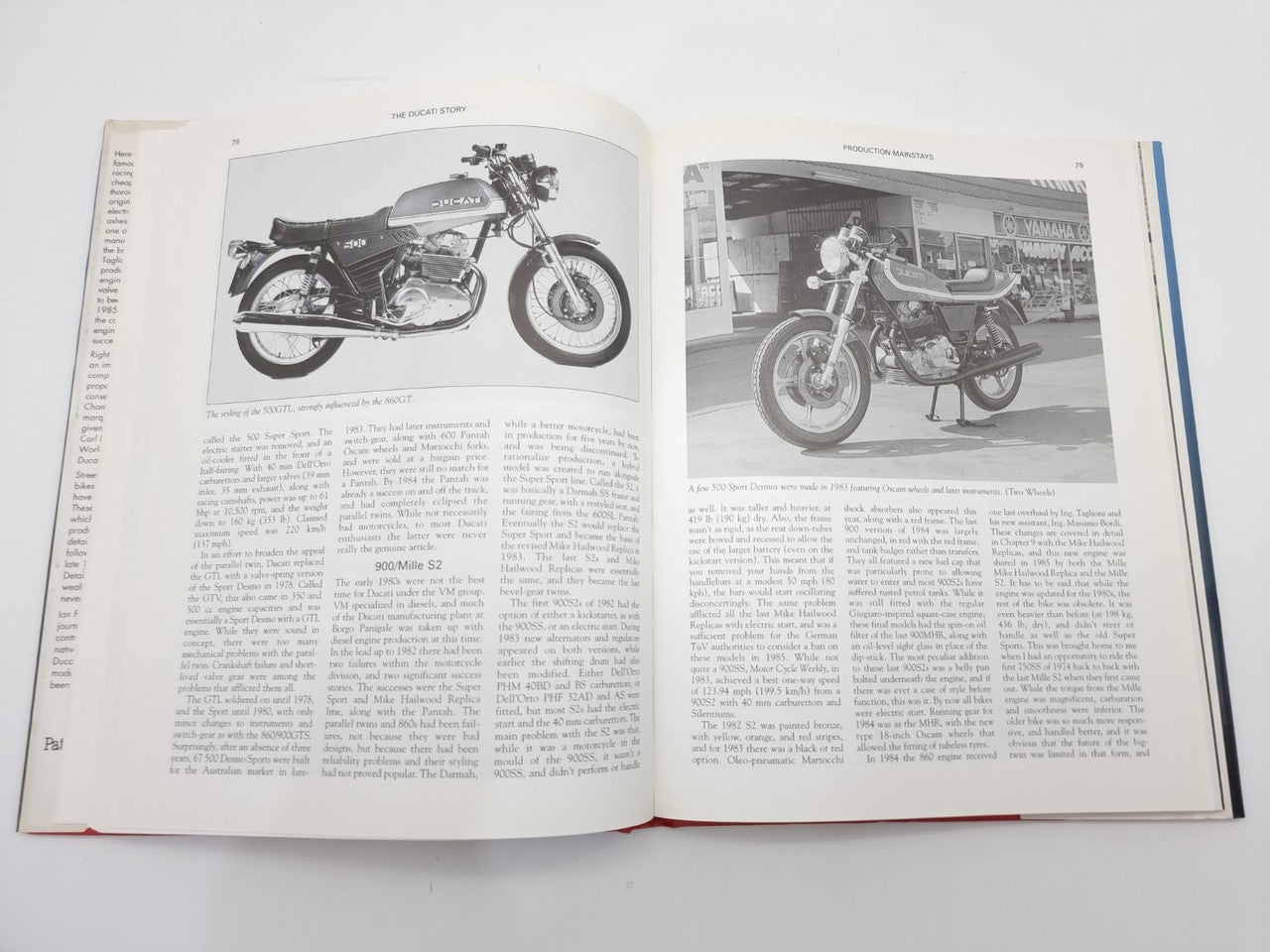 The Ducati Story open book with two black-and-white motorcycle image pages