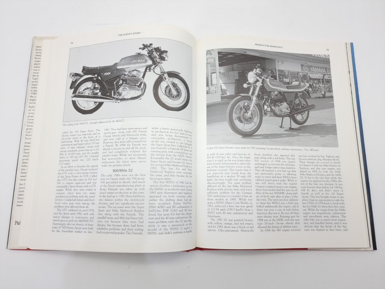The Ducati Story open book with black-and-white motorcycle photos and captions