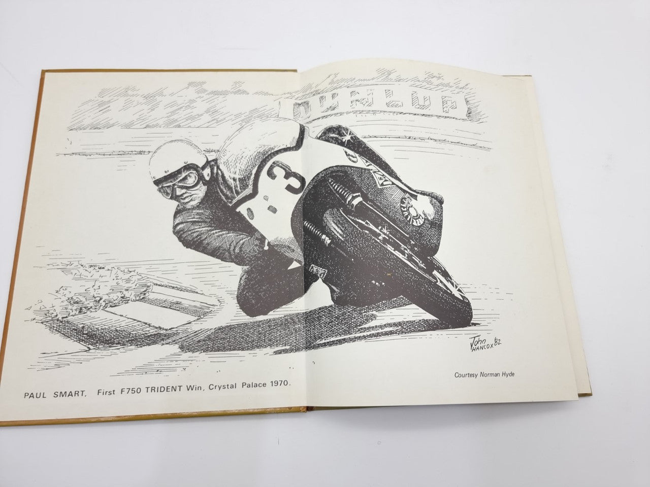 Triumph Trident Super Profile motorcycle manual open spread with black-and-white bike photo.