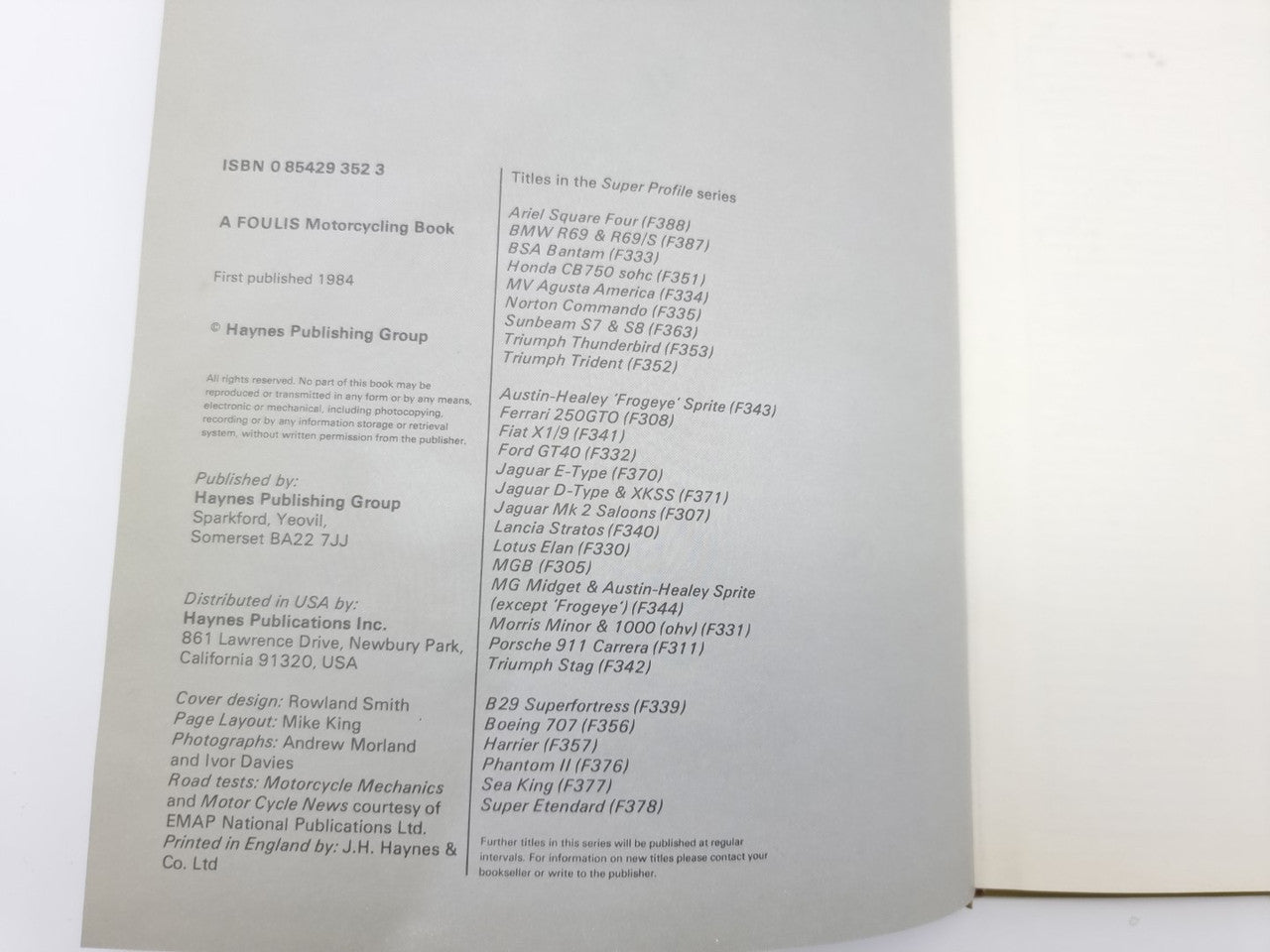 Triumph Trident motorcycle manual open to publication information page with fine print.