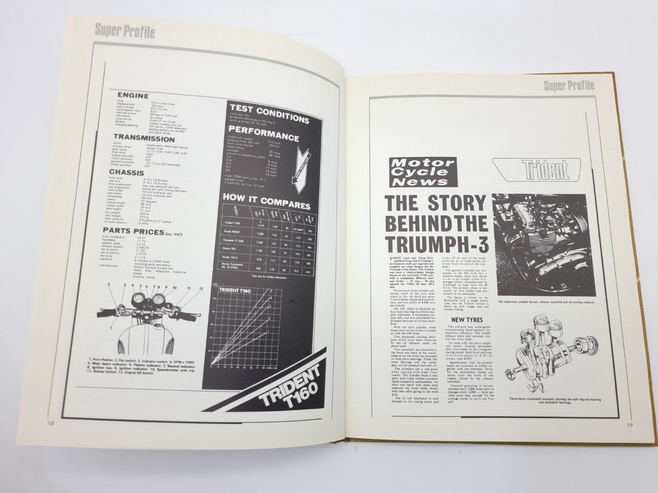 Triumph Trident motorcycle manual open spread with test tables and article 'TRIUMPH-3'.