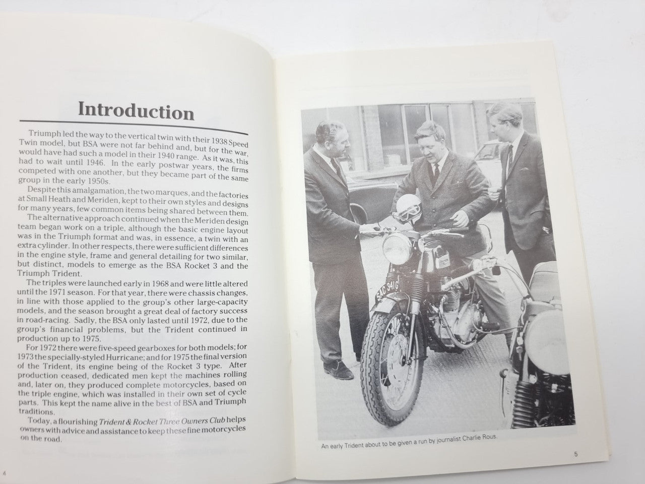 Motorcycle monograph book open to Introduction page with black-and-white rider photo