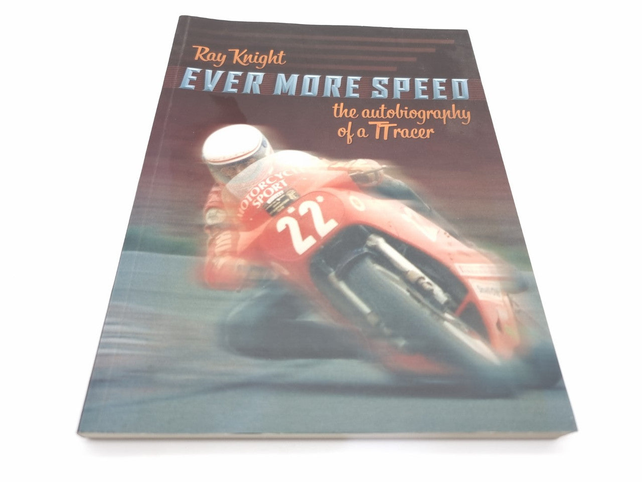 Paperback book cover with red motorcycle, number 22, and title lettering
