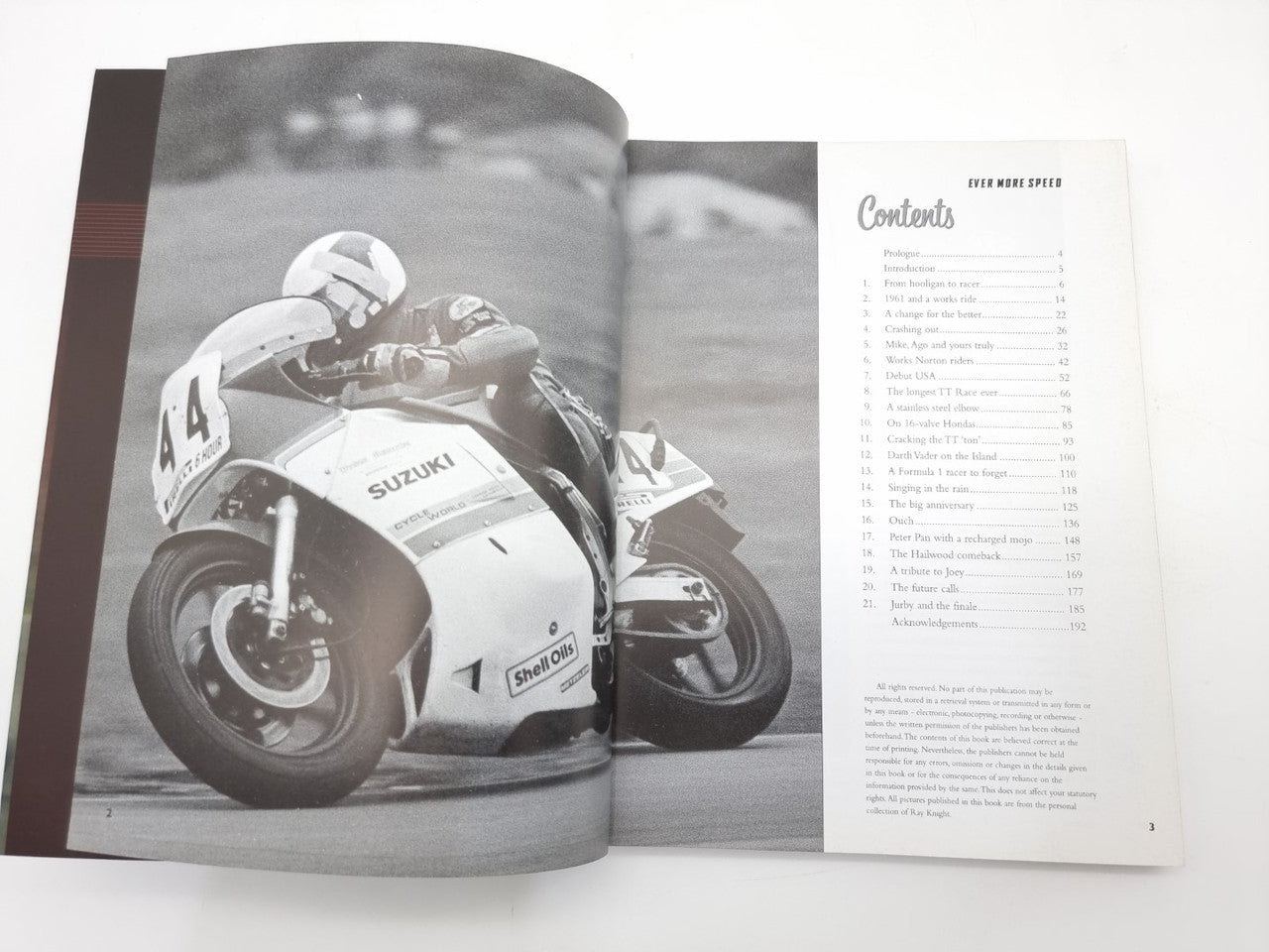 Open paperback showing black-and-white motorcycle photos and right-page contents list