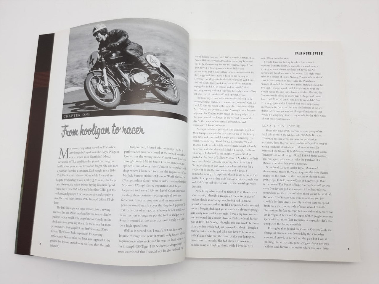Open paperback featuring a black-and-white motorcycle photo with chapter text below