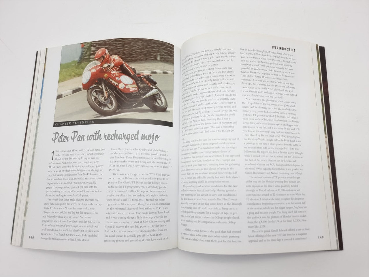 Open book with color motorcycle photo on left page and dense text on right