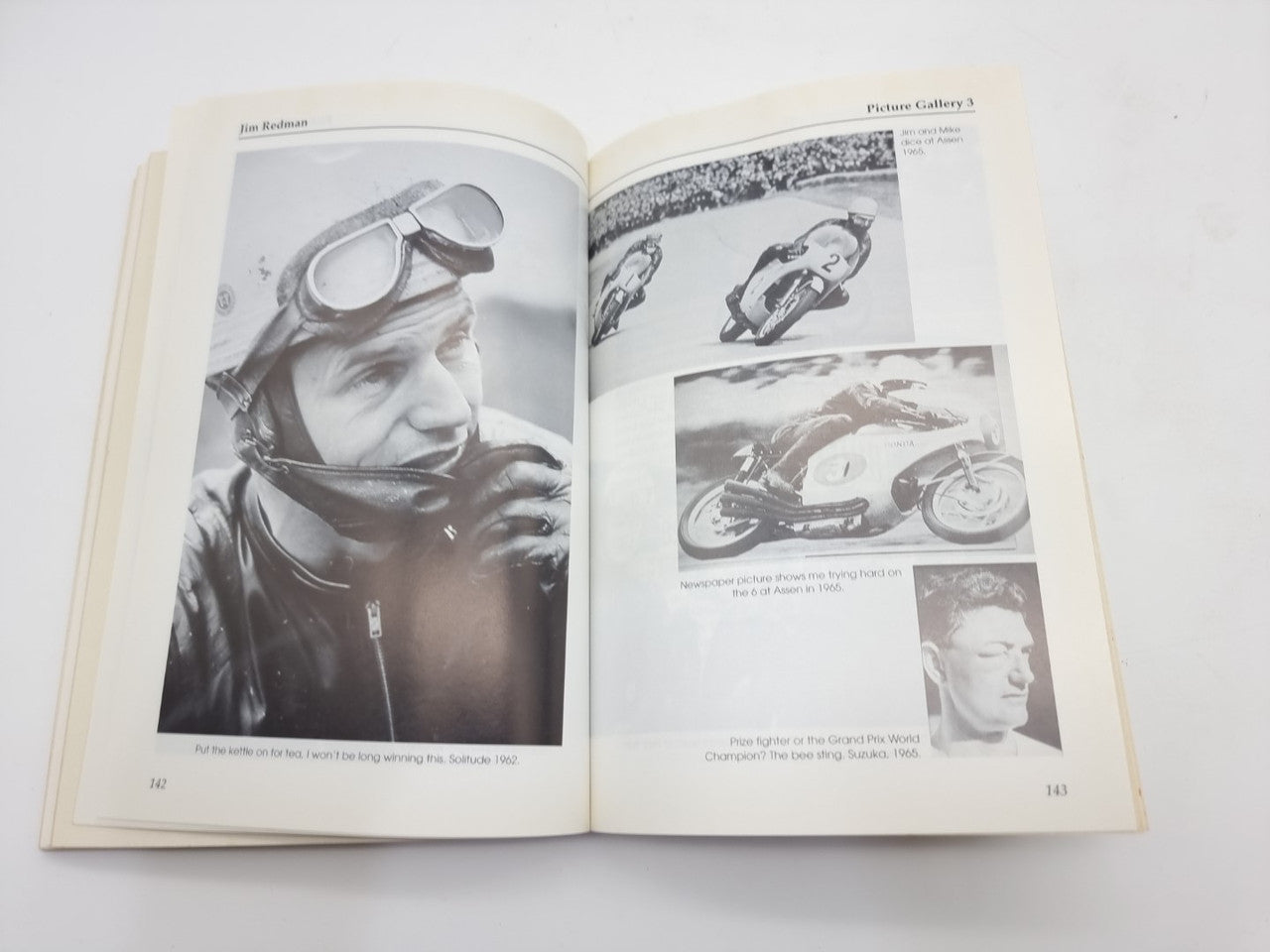 Open book spread with black-and-white photos, including a racer portrait and motorcycles