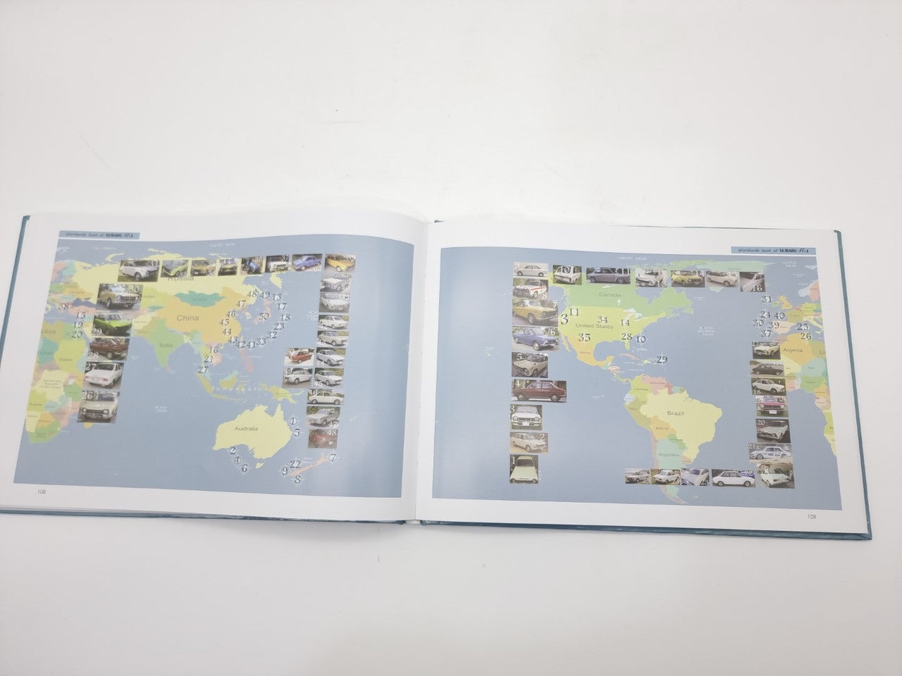 Open Subaru car manual with two map pages and small photo callouts