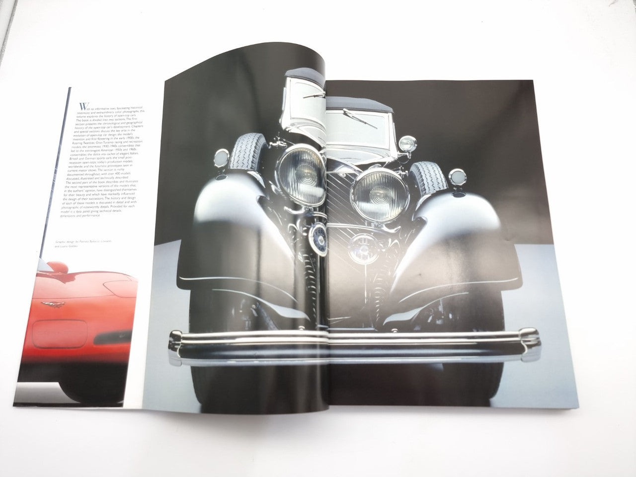 Convertible car photo spread in a book, close-up front view with chrome grille and lights.