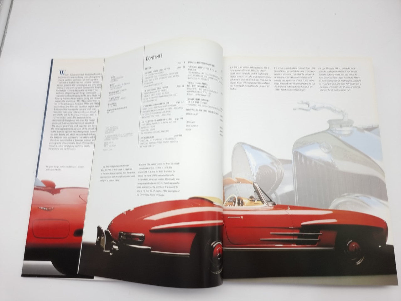 Open book spread with a red convertible sports car and side-view model photo.