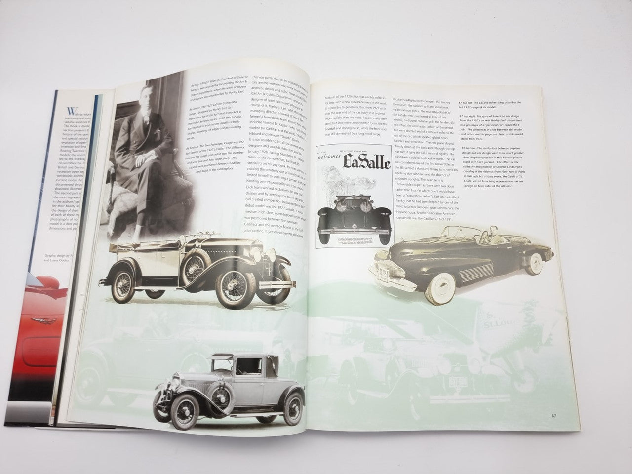 Open book spread with classic convertibles, black and dark green car photos.