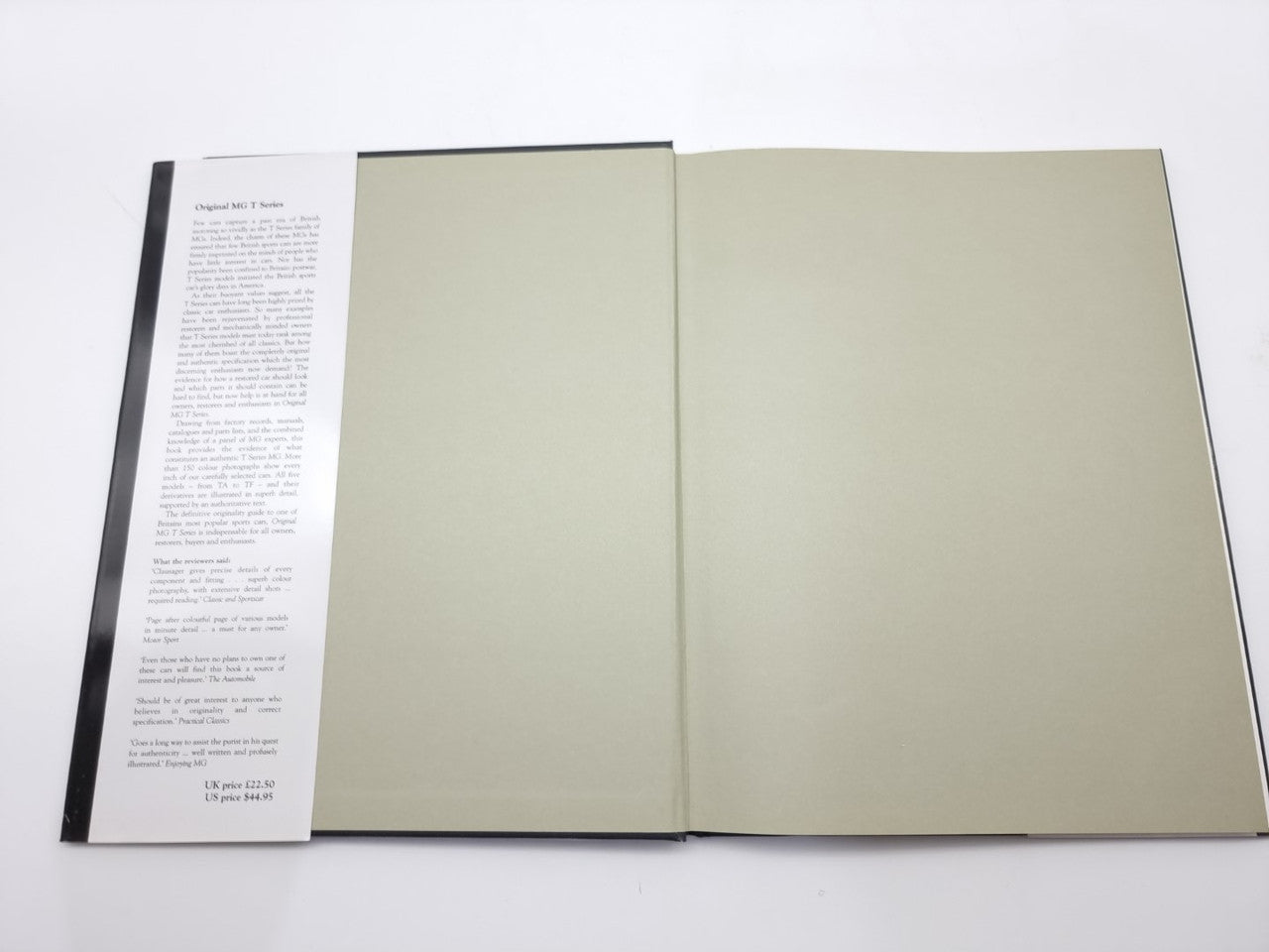 Open book with two blank beige pages and a single printed page on the left
