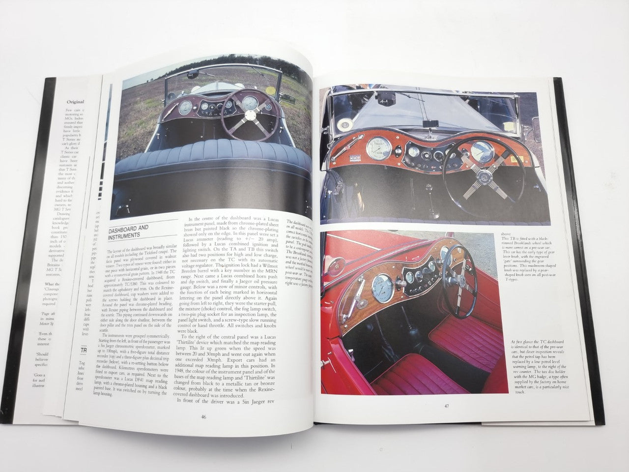 Open book with car cockpit and dashboard photos beside columns of printed text