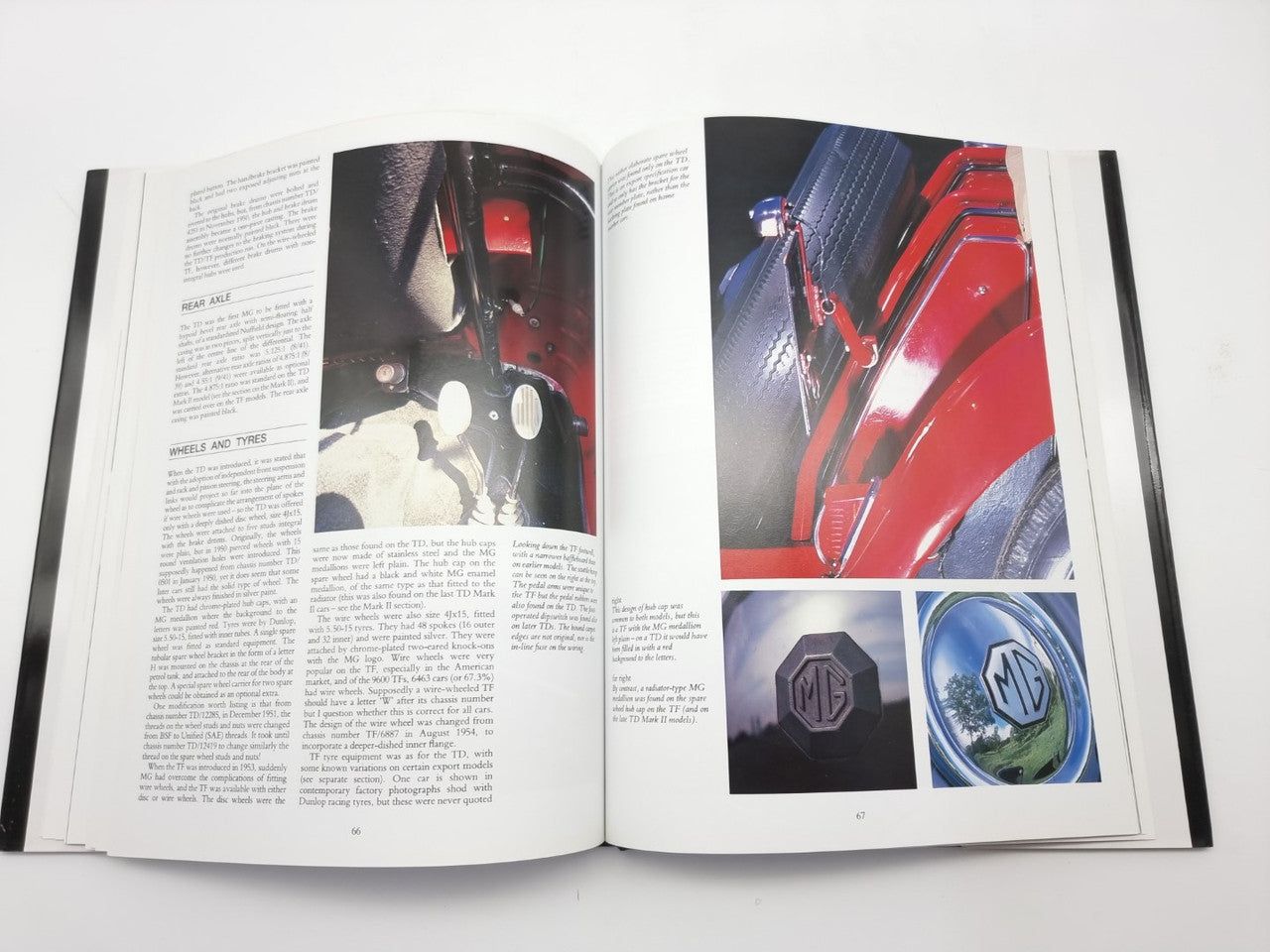 Open MG T Series restoration guide book with photo pages and diagrams.