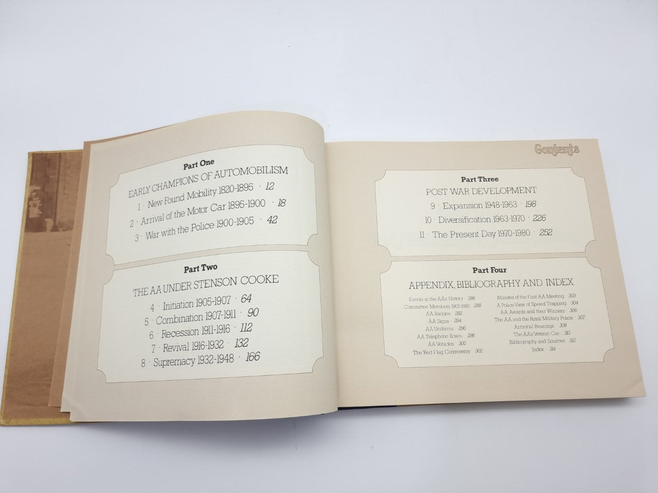 AA automobile association history book, open pages with tables and section listings