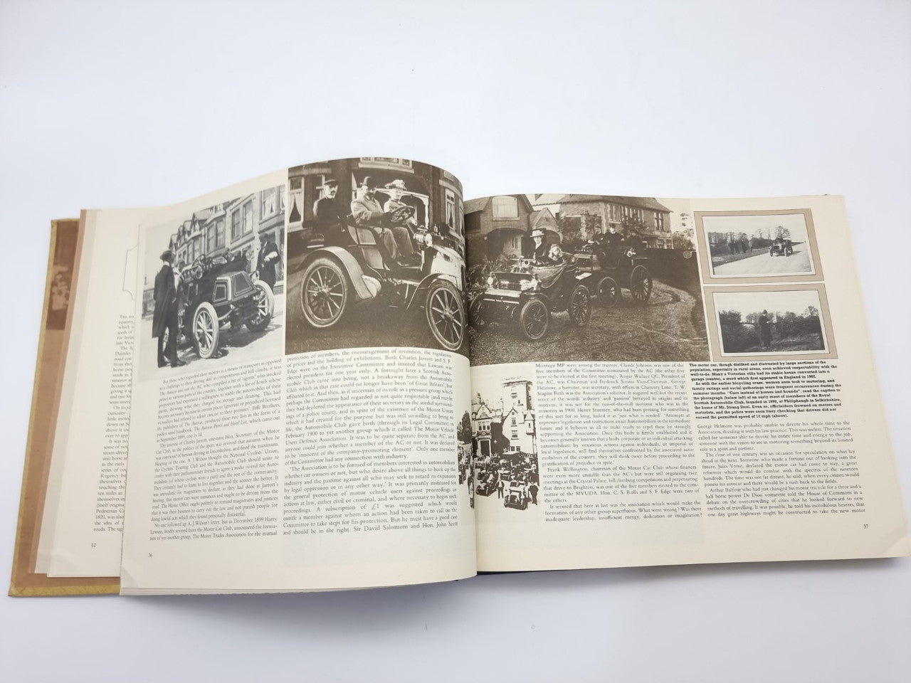AA automobile association history book, open pages with multiple car and street photos