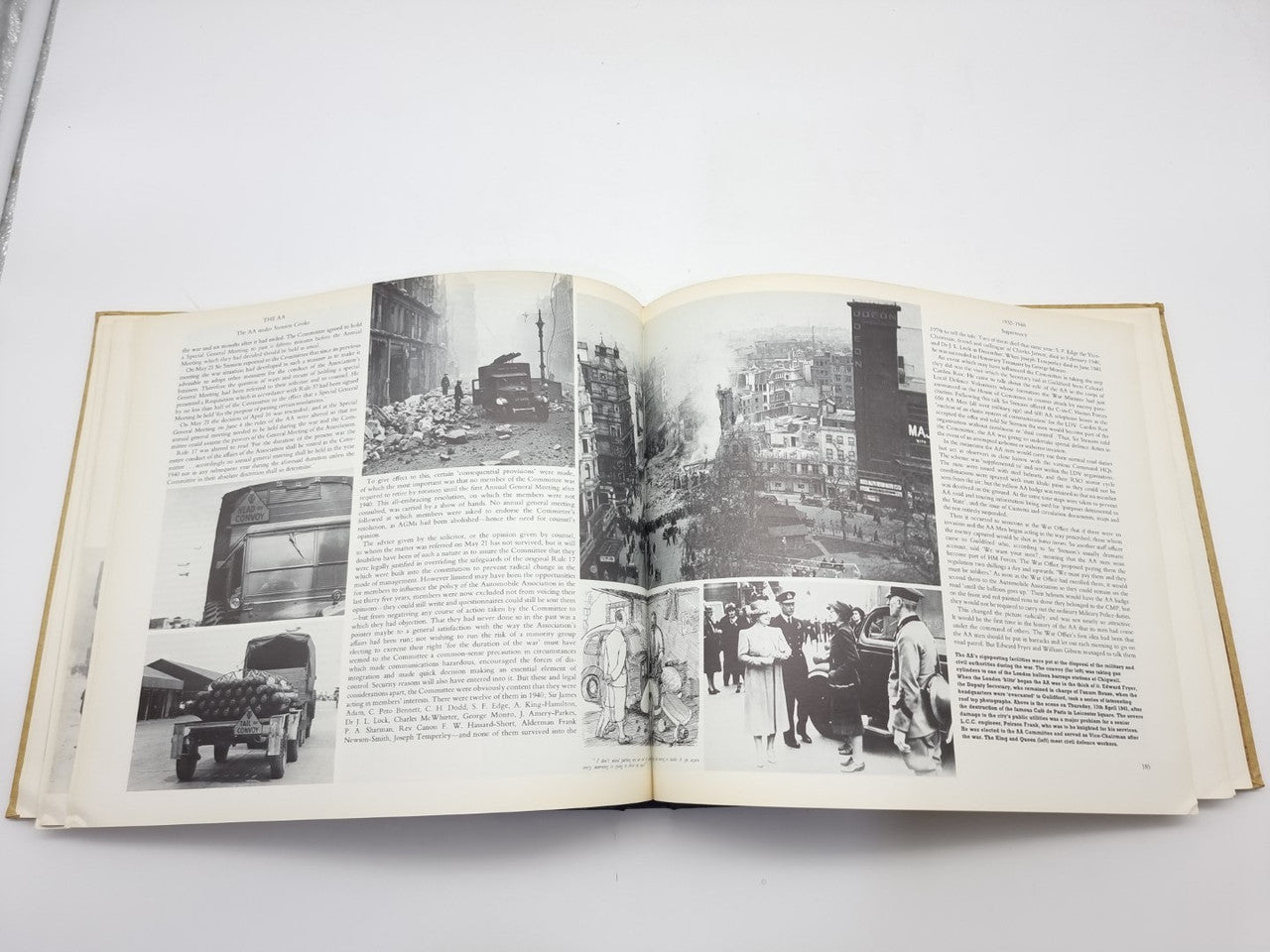 AA automobile association history book, open spread with street and city photos
