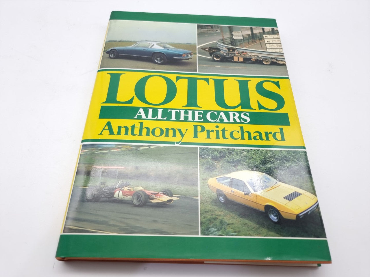 Lotus collector book with colorful cover featuring racing car photos and title text