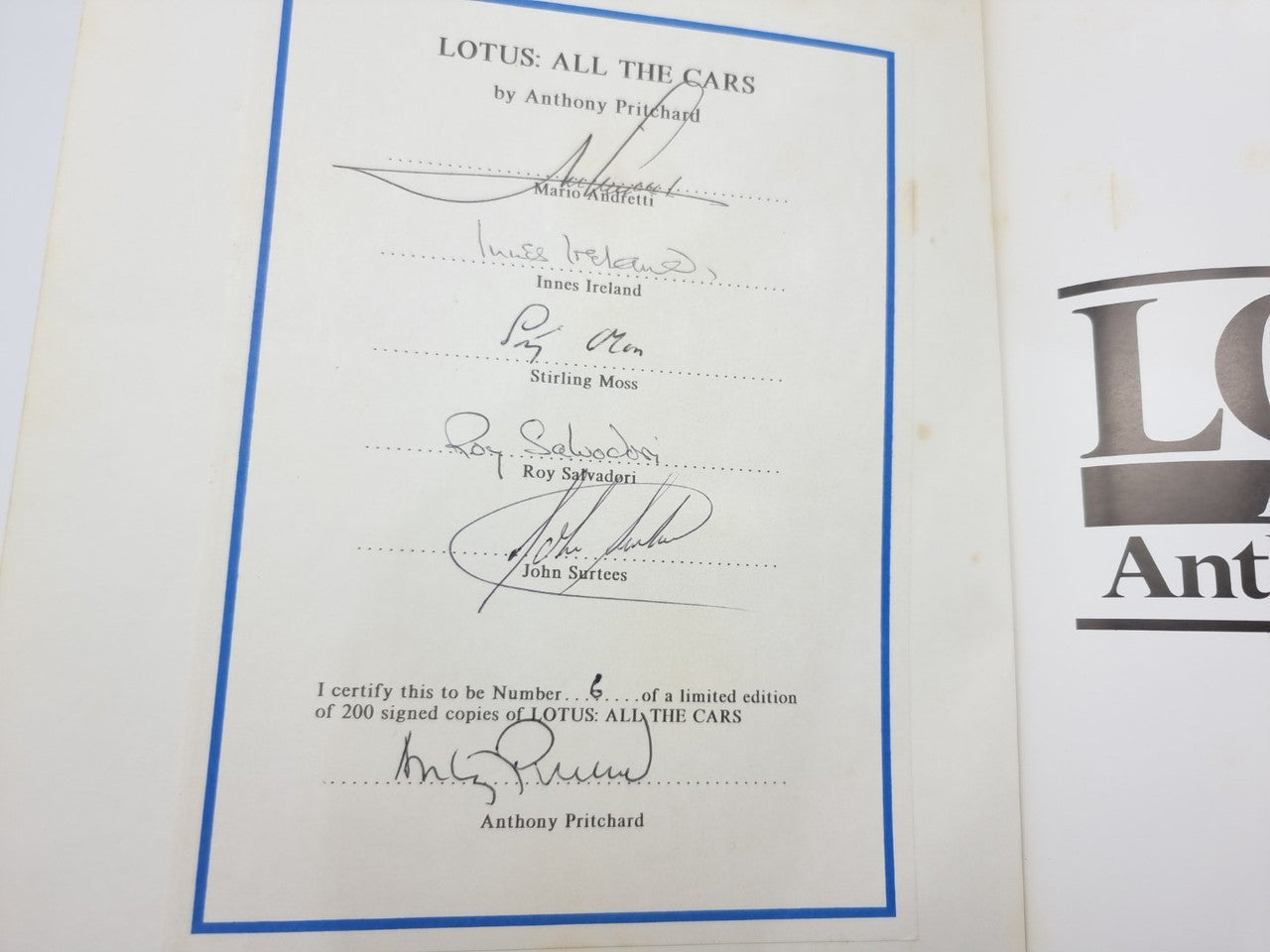 Certificate page with blue border, handwritten signatures, and edition number details